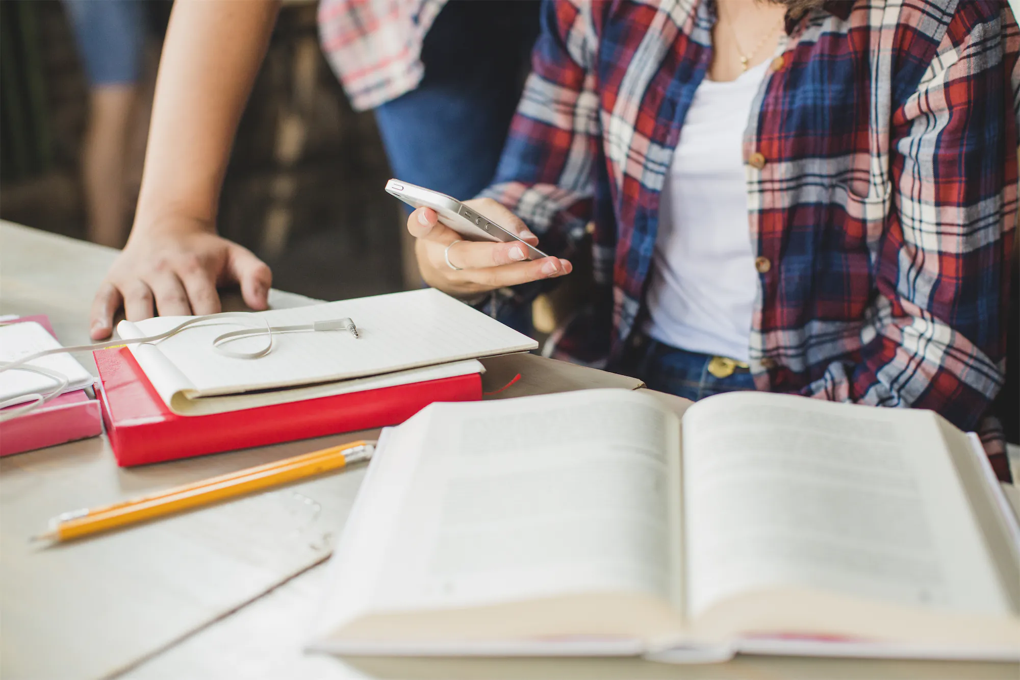 crop-student-with-phone-table
